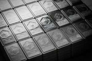 A pile of silver bars sitting on top of a table